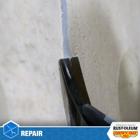 Concrete Crack Repair Sealant Quick Set Pro 8.6 Oz used on concrete wall for sealing cracks, black tool applying sealant
