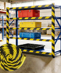 Heavy Duty U Channel Edge Corner Guard 197 Inch Yellow Black Self Adhesive NBR Foam Safety Tape on warehouse shelf with safety items.