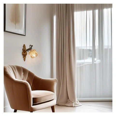 LMAPLUMP Wall Lamp Wall Sconce Classical European Vintage Antique Zinc Alloy Flower Glass Shade Crystal Accents Light for Bedroom Bedside next to a beige armchair.