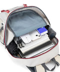 Open view of 35L Water Resistant Daypack For Outdoor Adventures Foldable Hiking Backpack with items like umbrella and laptop inside