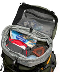 Open PhotoSport Pro 55L AW IV Camera Backpack showing interior storage and compartments for gear, green all-weather design.