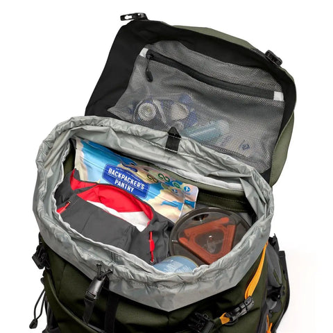 Open PhotoSport Pro 55L AW IV Camera Backpack showing interior storage and compartments for gear, green all-weather design.