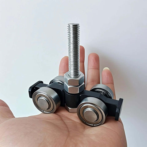 Hand holding Unistrut Trolley Assembly with Four Wheel Silent Rollers for One and Five Eighths Inch Wide and Taller Strut Channel