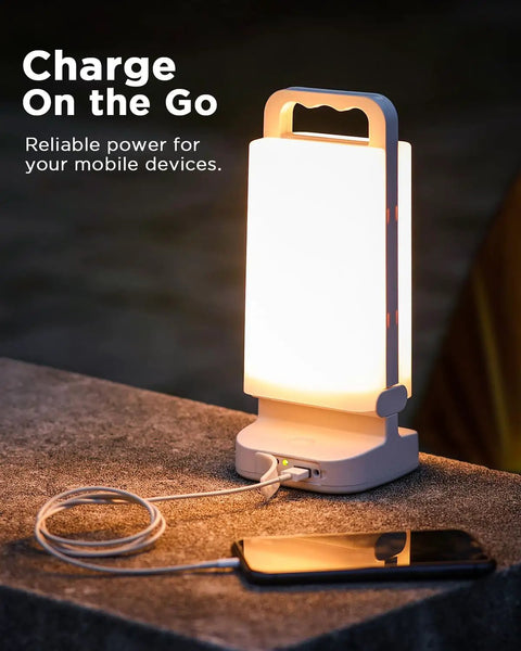 Solar Camping Lantern With 6000mAh Rechargeable Battery Up To 80 Hours Of Light Dimmable Night Lamp charging smartphone outdoors