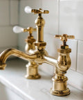 Brass faucet with dual handles on marble sink, ideal for No Brainer Do It Yourself Quick Connect Float Adapter Repair Kit For Plumbing Maintenance 17VB Replacement For Leaky Sinks And Faucets Durable Steel Build With Erosion Resistant Coating For Coastal Humid Environments.