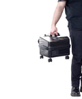 Person holding a portable heavy duty commercial steam cleaner with 90 psi and 325 degrees dual boiler setup for continuous refill.