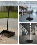 Heavy Duty Upright Standing Dustpan Built Different Tight Pivoting Base Perfect For No Sweat Daily Sweep on outdoor surface with debris.