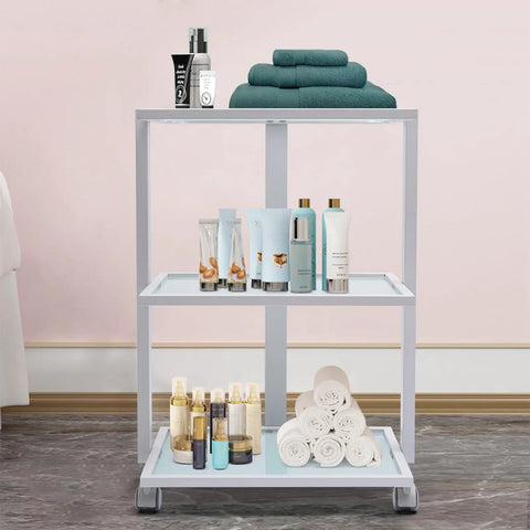 Three Tier Beauty Cart On Wheels With Heavy Duty 330 Lb Capacity All Purpose Rolling Trolley Organizer with towels and bottles visible