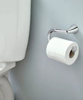 Glyde Brushed Nickel Toilet Paper Holder With Pro Fit Installation near toilet in a bathroom setup