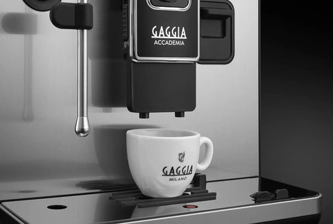 Top Tier Heavy Hitter Italian Fully Automatic Espresso Machine With Brushed Stainless Steel Housing pouring into a Gaggia cup.