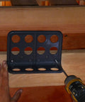 Installation of Box Of Fifty H2 Homer Helpers For Electrical Wire Management, a black plastic cable bracket mounted on wood.