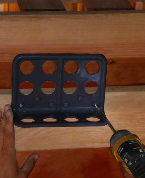 Installation of Box Of Fifty H2 Homer Helpers For Electrical Wire Management, a black plastic cable bracket mounted on wood.