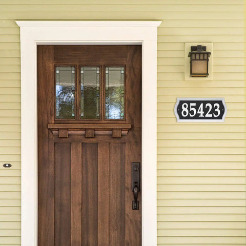 Reflective Address Numbers Sign With High Visibility Panels Weather Resistant Easy Mount For Front Porch Or Mailbox Post Boost Your Curb Appeal And Help Visitors Find Your Home At Night mounted beside wooden door on beige wall