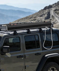 Portable Road Shower For Camping And Outdoors, 5.3 Gallon Pressurized Water Tank mounted on SUV roof with chrome head