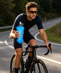 Cyclist holding Foldable Hydration Bottle For Hiking And Running, 11.42 Inch Squeeze Bladder With Leakproof Caps, blue design