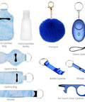 Everyday Safety Keychain Set For Women And Kids With No Touch Door Opener Personal Alarm Whistle Pom Pom And 10 Self Defense Accessories For Girls With Loud Safe Sound Alerts Up To 500 Feet showing sanitizer holder, pom, personal alarm, whistle, and opener.