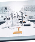 Easy To Use Pendulum Inertia Demonstrator For Physics Labs on a classroom table with lab equipment.