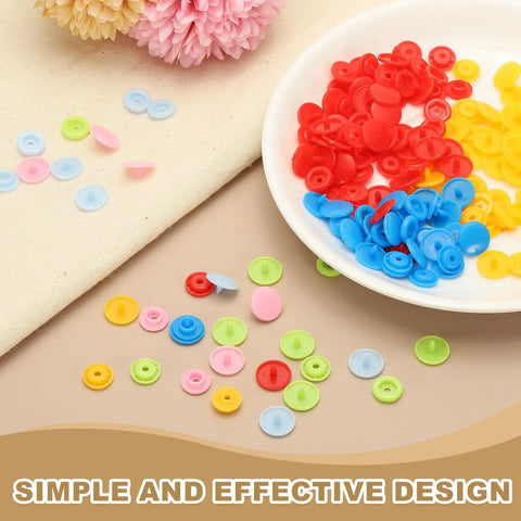 Assorted colored resin snap buttons on a plate and table for sewing crafts