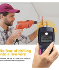 Professional Digital Wall Stud Finder And Voltage Scanner in use to locate wood frames and live wires while drilling.