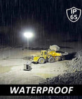 100W 2000Lm Led Work Light Rechargeable Portable Floodlight Ip65 Water illuminating a construction site during rain.