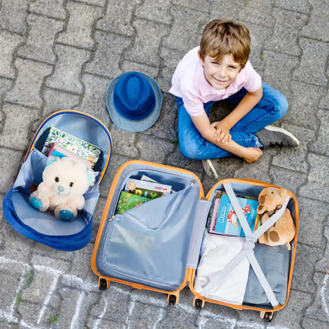 Two Piece Kids Luggage Set With 12 Inch Backpack And 18 Inch Rolling Suitcase In Blue Astronaut Design Lightweight Durable ABS Hardshell Kid Friendly Carry On Travel Gear For Boys And Girls shown opened with toys and books.