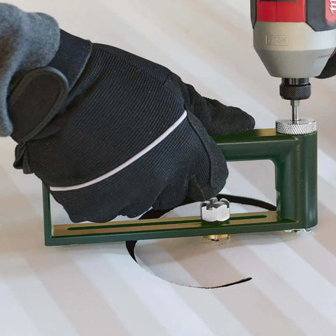 Person using Adjustable Circle Hole Cutter for Sheet Metal 2 to 12 Inch with 2 Drill Bits for cutting round hole in metal sheet.