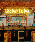 Custom Outdoor Neon Sign Waterproof LED Light Up Sign For Backyard Patio Pool Garden Wedding And Party Use Personalize Your Text With IP67 Power Supply For Rain Or Shine displayed at a tiki bar.