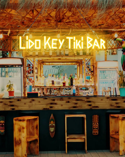 Custom Outdoor Neon Sign Waterproof LED Light Up Sign For Backyard Patio Pool Garden Wedding And Party Use Personalize Your Text With IP67 Power Supply For Rain Or Shine displayed at a tiki bar.