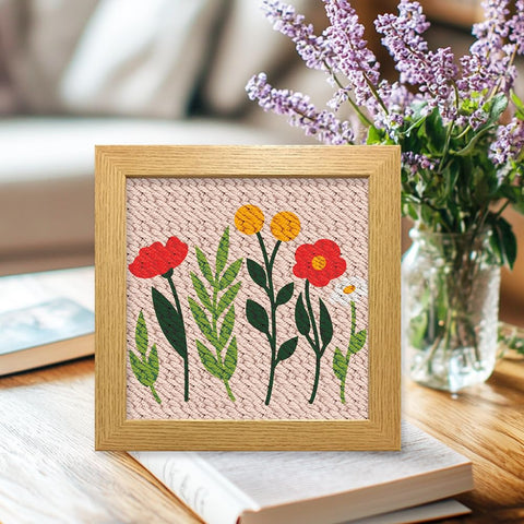 Wildflower Punch Needle Kit Two Pack For Beginners, Embroidery Set with floral pre-printed fabric in wooden frame on table