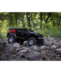 SCX24 Jeep Gladiator One Twenty Fourth Scale 4x4 Rock Crawler Ready To Run Brushed RC Car on rocky trail