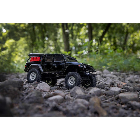 SCX24 Jeep Gladiator One Twenty Fourth Scale 4x4 Rock Crawler Ready To Run Brushed RC Car on rocky trail