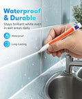 Hand using Grout Fix Pen For Tile Grout Lines Waterproof Tile Repair Marker For Ceramic Walls And Floors Quick DIY Refresh