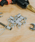 Heavy Duty Aluminum Spacer Round Unthreaded Standoff Bushing With Plain Finish, One Half Inch Outer Diameter And Three Eighth Inch Inner Diameter, Choose Your Length, Fits Five Sixteenth Inch Or M Eight Bolts, Two Inch Length Pack Of Five displayed with tools on a wooden surface