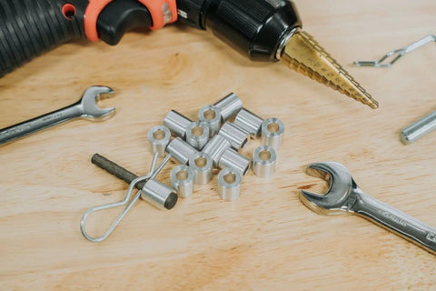Heavy Duty Aluminum Spacer Round Unthreaded Standoff Bushing With Plain Finish, One Half Inch Outer Diameter And Three Eighth Inch Inner Diameter, Choose Your Length, Fits Five Sixteenth Inch Or M Eight Bolts, Two Inch Length Pack Of Five displayed with tools on a wooden surface
