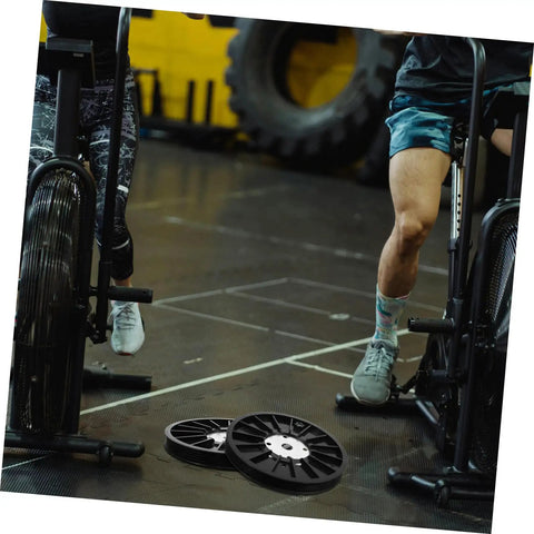 Upgrade Your Home Gym With A Dope Heavy Duty Exercise Bike Belt Pulley Disc on gym floor, ready for installation