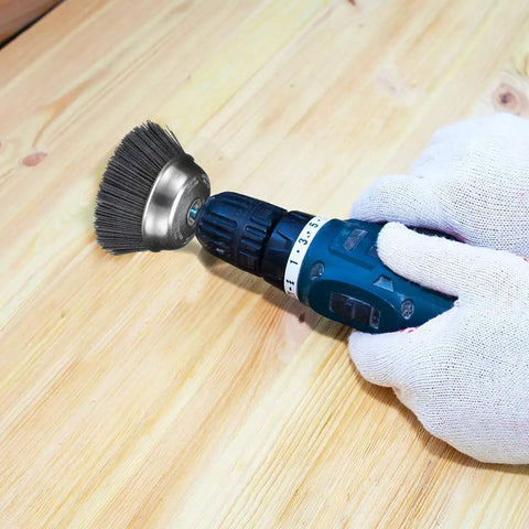 Gloved hands using Abrasive Cup Brush Silicon Carbide 7000 Max RPM 6 Inch Heavy Duty on wooden surface for machining projects
