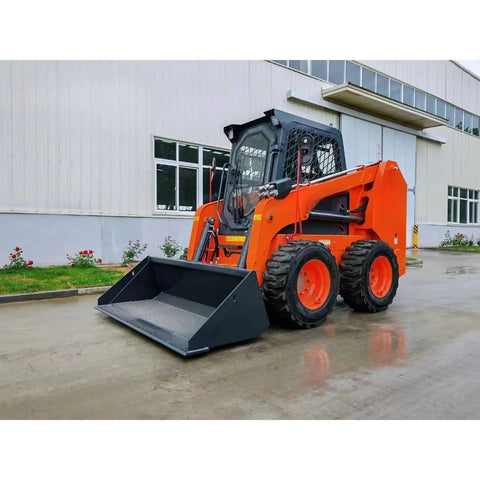 Compact Mini Track Skid Steer Loader Workhorse For Construction, Landscaping And Material Handling Tasks in front of building