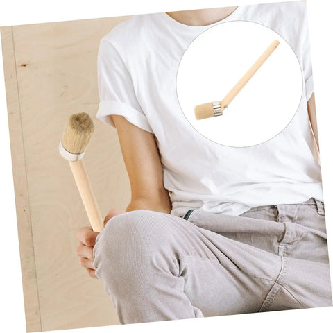 Person holding a Wood Handle Pig Bristle Paint Brush For Acrylics Stain And Wall Painting Awesome For DIY Furniture And House Projects.