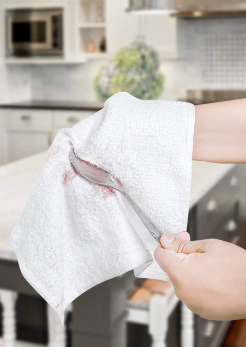 Person wiping a spoon with Pack Of 50 White 12 By 12 Inch Cotton Terry Cleaning Cloths For Auto Detailing, Painters, And General Cleaning