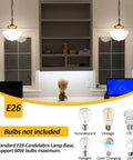 Schoolhouse Pendant Light Fixture 9 Inch Brass Gold Milk Glass Shade Adjustable Mid Century Ceiling Pendant for Bedroom Kitchen Living Room Hallway or Dining Room Cool Vibe Modern Rustic Glow, shown illuminating a workspace with decorative shelving.