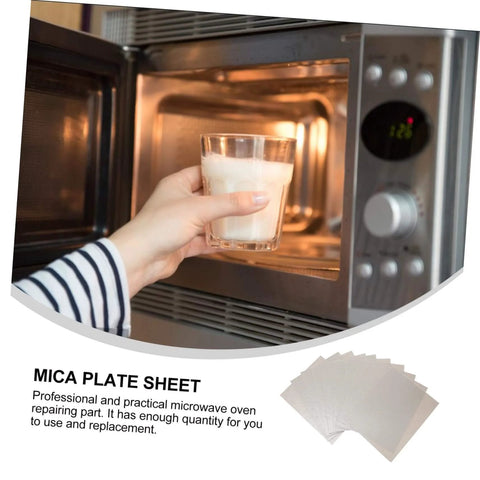 Hand placing glass in microwave, showing functionality of 12 Pack Mica Plate Sheets For Microwave Waveguide Covers, Heat Resistant Insulation