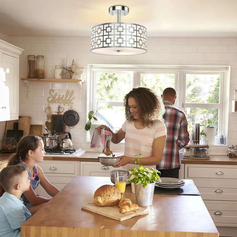 Family kitchen with Three Light Flush Mount Ceiling Light in Brushed Nickel with a Modern Drum Design and Double Shade.