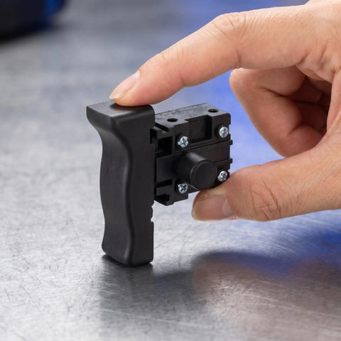 Rugged Reciprocating Saw Switch Replacement For Electric Chainsaw And Handheld Power Tools Featuring Rock Solid Locking Trigger shown in hand.