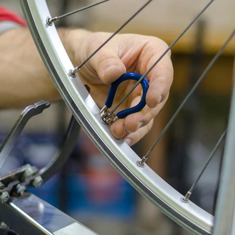 Using 12 Piece Bicycle Spoke Tool Set With Tension Meter And Aluminum Alloy Wrenches For Quick Wheel Adjustments on bike wheel