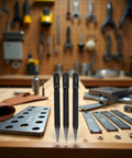 No Nonsense Center Punch Set With Rock Solid High Carbon Steel Build on workbench with various tools visible.
