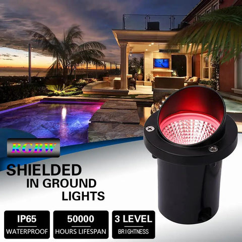 Evening view of installed Eight Pack RGBW Landscape Lights For Outdoors, In-Ground Well Lights, illuminating with red light
