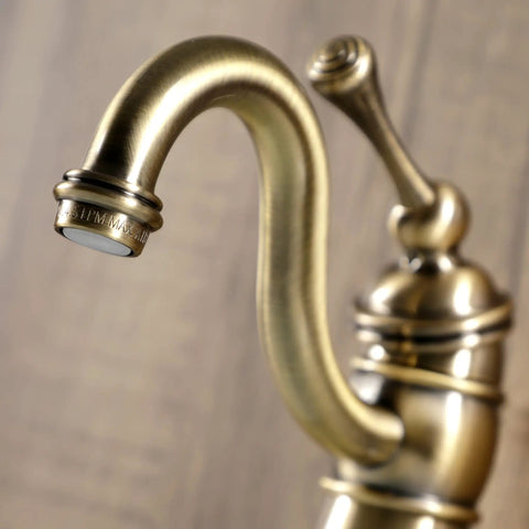 Close-up of Victorian Mono Block Bathroom Faucet in Antique Brass with Drip Free Cartridge, 6 Inch Spout Reach, intricate design