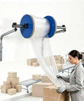 Hella Smooth Wall Mount Bubble Wrap Dispenser Stand With Easy Glide Roll Grip For Packing Crews Who Want Fast Access And Zero Shelf Clutter In Any Solid Shipping Room with bubble wrap being dispensed.