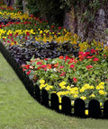 5.5 Inch Tall Garden Edging Border Kit With 20 Feet Of Flexible Plastic Border For Lawns Yards And Flower Beds Tools Free Install With 30 Anchoring Spikes Black shown outlining colorful flower bed