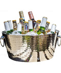 Hammered Stainless Steel Beverage Tub With Double Walled Insulation Anchored Ice Bucket Chiller For Epic Parties 12 Quarts Double Hinged Handles Heavy Duty Party Cooler That Keeps Drinks Ice Cold filled with drinks and ice